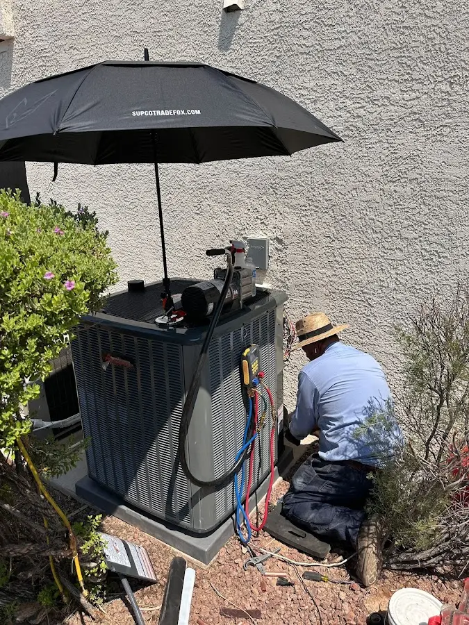 HVAC technician performing outdoor AC maintenance in Mount Kisco