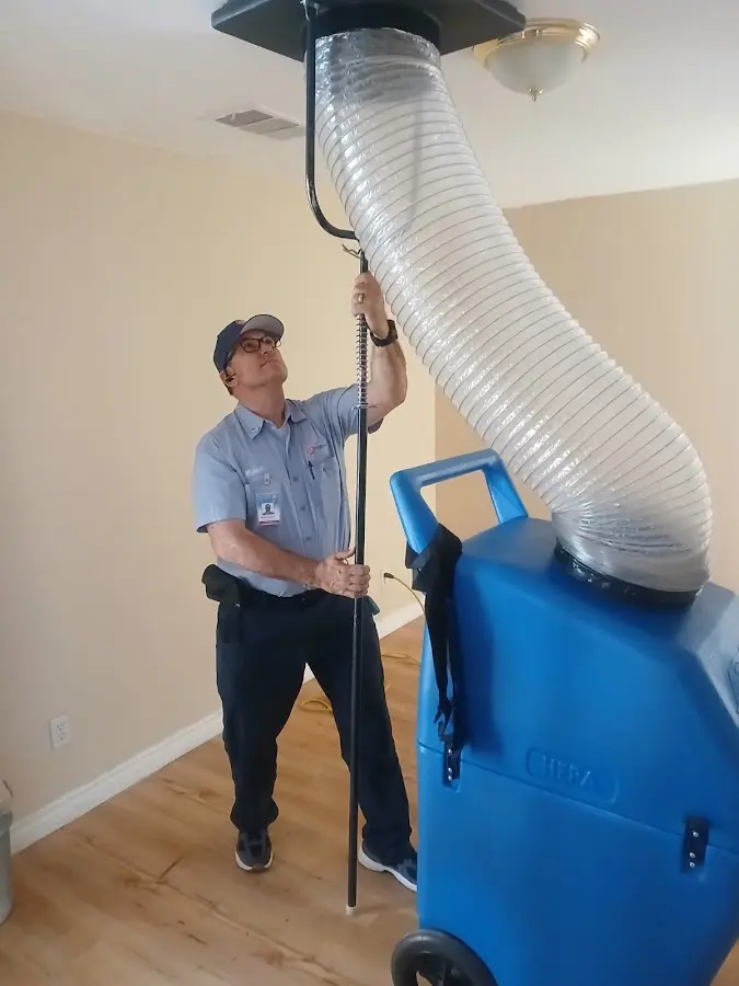 Furnace Tune-Up technician using HEPA equipment in Mount Kisco